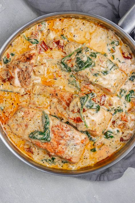 Creamy Tuscan Salmon Tuscan Salmon And Shrimp Pasta, One Pan Fish Recipes, Tuscan Salmon Natasha’s Kitchen, Pescatarian One Pot Meals, Tortellini Salmon Recipes, Tuscan Cod Recipe, Buttery Salmon Recipes, Taziki Salmon Recipe, Creamy Tuscan Sauce