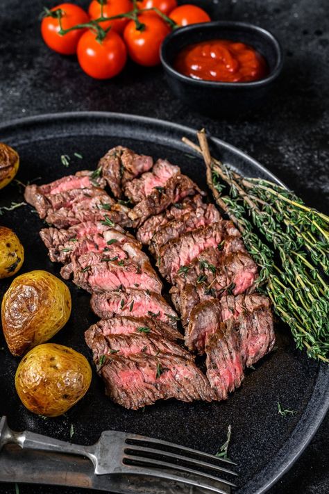 Ina Garten's Marinated Flank Steak combines vegetable oil, soy sauce, red wine vinegar, lemon juice, Worcestershire sauce, Dijon mustard, garlic, and black Denver Steak, Ostrich Meat, Steak Grilled, Marinated Flank Steak, Flank Steak Recipes, Tender Steak, Grilled Flank Steak, Bbq Beef, Tri Tip