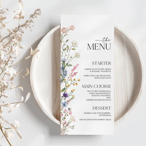 Elevate your wedding day with our exquisite Wildflower wedding menu card.This beautifully crafted wildflower menu template captures the essence of your love story with its elegant wildflower design.Each detail is thoughtfully created to set the tone for your special day. You can customize the text, fonts and colors to make it uniquely yours! The listing is a digital editable wedding menu template download only, no physical product will be shipped. You will receive the access link after purchase Floral Wedding Menu Design, Flower Menu Design, Wedding Floral Invitations, Floral Menu Design, Set Menu Design, Unique Menu Design, Menu Ideas Wedding, Boho Flowers Wedding, Wedding Menu Design