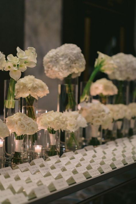 Modern mirror escort card table with an assortment of mono-floral white arrangements. Sleek and modern Philadelphia Ritz Carlton Wedding. White rose bridesmaids bouquets re-purposed on the escort card table. PC Alison Conklin Photography Rose Bridesmaid Bouquet, Ritz Carlton Wedding, Table Pc, Bridesmaids Bouquets, Card Table, Wedding White, Modern Mirror, Ritz Carlton, Floral White