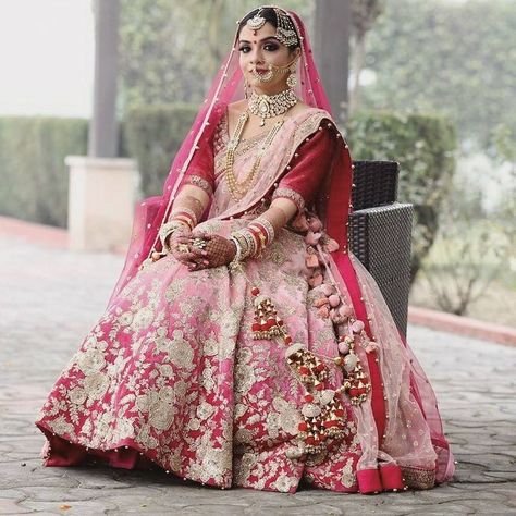 Stunning red and light pink ombre lehenga with cute pom pom bridal kaleere. See more on wedmegood.com #wedmegood #indianwedding #indianbride #bridallehenga #lehenga #kaleere #pompom #jewelry #bridaljewellery #jewellery #kaleere Latest Bridal Dress Design, Silver Bridal Dress, Ethnic Lehenga, Pink Bridal Lehenga, Pakistani Brides, Dubai Sharjah, Raw Silk Lehenga, Brides Dress, Bridal Attire