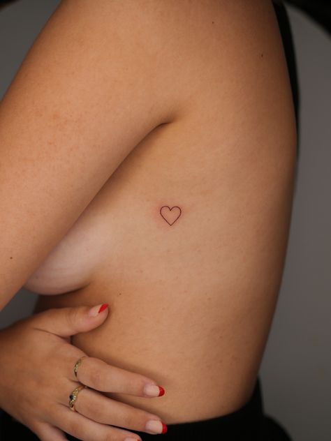 Mini Heart Tattoo Placement, Heart On Back Tattoo, Minimalist Tattoo Heart, Heart Sternum Tattoo, Dainty Heart Tattoo, Heart Tattoo Placement, Fine Line Heart Tattoo, Little Heart Tattoos, Simple Heart Tattoos