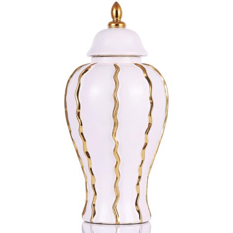 PRICES MAY VARY. Timeless Sophistication in White and Gold: Adorn your space with the understated elegance of our 18.1-inch white and gold ginger jar. Its dimensions (8.66 L x 8.66 W x 18.1 H inches) make it an imposing yet graceful addition to any decor. This large ginger jar marries the classic allure of white ceramic with the opulent shimmer of gold, creating a perfect harmony of colors that enhances any home setting Versatile Home Accent: This exquisite ginger jar transcends its traditional Dining Table Cabinet, Cabinet Bookshelf, Vase With Lid, Table Cabinet, Gold Palette, Decor Storage, Kitchen Dining Table, Gold Ceramic, Jar Vase