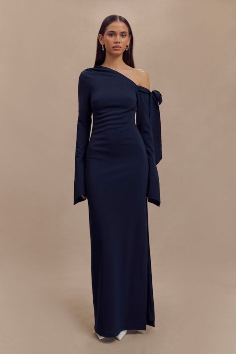 Contemporary glamour. The NICOLA One Shoulder Crepe Maxi Dress is a stunning blend of modern elegance and timeless sophistication. Featuring an asymmetrical neckline with a chic open shoulder and ruched detailing, this dress exudes contemporary glamour. The ruching at the waist enhances the silhouette, creating a flattering, body-skimming effect. With a functional tie at the shoulder for adjustable styling, a side zip for a smooth fit, and stretch fabrication for added comfort, the Nicola Dress Matric Dress, Crepe Maxi Dress, Asymmetrical Neckline, Grad Dresses, Navy Dress, Classy Dress, Elegant Outfit, Modern Elegance, Dress Designs