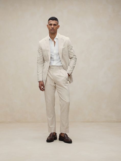 Designed with warm climates in mind, this sleek white suit pant is cut from an herringbone fabric that blends together soft cotton and luxurious linen.  Tailored Slim Fit: Mid-rise.  Tapered slim leg.  Zip fly with button-tab waistband.  Belt loops and after-dinner split detail at back.  Front and back pockets.  Half lined (lined to the knee).  Tailored Slim Fit: Mid-rise.  Tapered slim leg.  Inseams: Short 29. 5", Regular 31. 5", Long 33. 5" Model: Size 32 Regular, 6'2" (188cm). White Linen Suits For Men, Linen Men Outfit, Men Loafers Outfit, Linen Outfit Men, White Linen Outfit, Linen Suits For Men, Casual Groom Attire, Linen Pants Suit, Casual Grooms