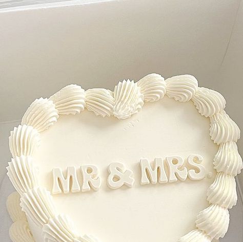 Baked by Julie | West Covina, CA on Instagram: "Mr & Mrs 🤵🏻‍♂️👰🏻‍♀️ • • • • #mrandmrs #whitecake #justmarried #weddingcake #weddingcakes #wedding #weddings #weddingseason #weddingseason2023 #lambeth #lambethcakes #lambethcake #vintage #vintagestyle #vintagecake #vintagecakes #buttercreampiping #cake #cakes #cute #cakelove #lacounty #cakesofinstagram #cakestagram #westcovina #supportsmallbusiness #626 #bakedbyjulie_ #customcakes #foodphotography" Pink Vintage Wedding Cake, M&s Wedding Cake, Wedding Cake Writing, Wedding Cake Heart Shape, Rome Editorial, 1 Year Anniversary Cake, Wedding Cake Heart, Just Married Cake, Cakes Cute