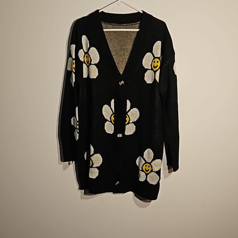 Gorgeous Black Cardigan With Flowers Smiley Face In The Middle Of The Flower. 100% Acrylic. Ptp 24-27 ", Length 33". Nwot Cardigan With Flowers, Black Cardigan, Smiley Face, Yellow Black, Black N Yellow, In The Middle, Cardigan Sweater, Smiley, The Middle