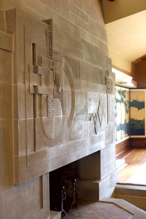 One of the standout moments in the space is the cast concrete fireplace, which is considered to be one of Wright’s greatest two-dimensional works of art. Depicting an abstract landscape, the detail is spectacular, yet leaves much to the imagination while incorporating a bit of the hollyhock flower. Wright completed the fireplace with a skylight above and a moat in front that was designed to hold a pool of water. This was originally part of an elaborate water scheme to run throughout the prop... Hollyhock House, Ennis House, Country Fireplace, Tv Over Fireplace, Cabin Fireplace, Slate Fireplace, Fireplace Cover, Paint Fireplace, Cast Concrete