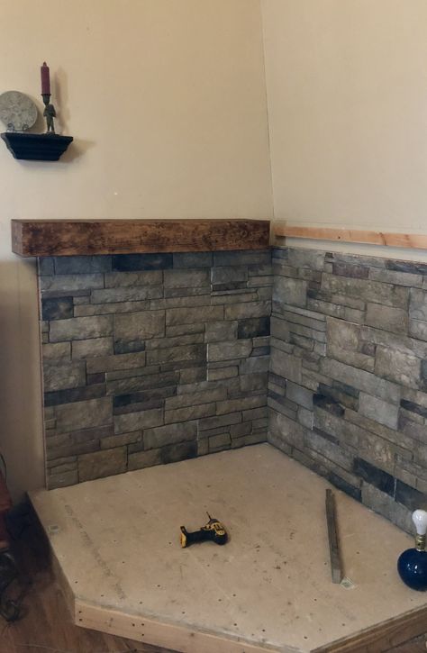 Faux Stone Fireplace Wall, Rock Wall Behind Wood Stove, Diy Hearth For Wood Stove, Pellet Stove Mantle, Corner Pellet Stove Ideas Living Rooms, Corner Pellet Stove Mantle, Small Mixed Pebble Rock Wood Stove Wall, Wood Burning Stoves Living Room Corner, Wood Stove Surround Corner Stone Walls