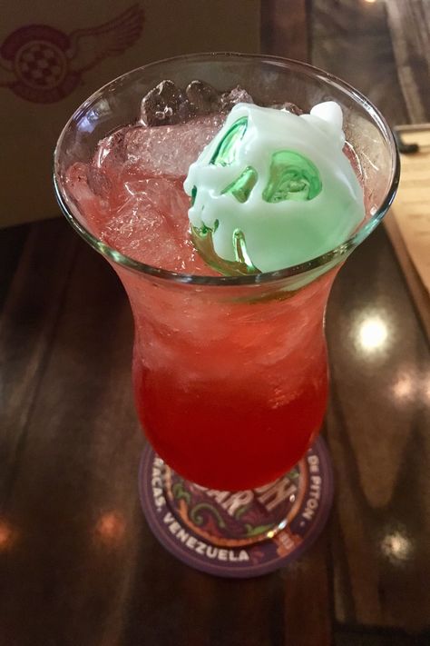 Jock Lindsey’s Hangar Bar Halloween Cocktails bring a splash of villainy to Disney Springs with a whole lot of rum and a poison apple glow cube. Disney Poison Apple, Disney Poison, Glow Cube, Forbidden Apple, Cocktail Halloween, Apple Cocktail, Twenty Something, Poison Apple, Poison Apples