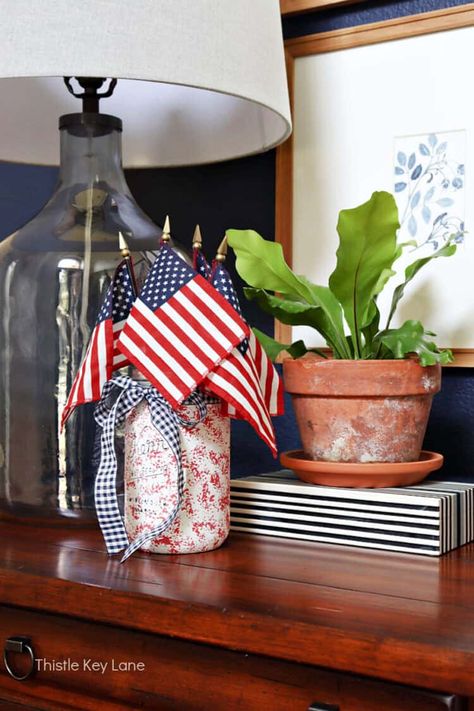 Favorite July 4th Decorating Ideas - Get ready for summer celebrations with these simple patriotic decorating and craft ideas. How to decorate with American flags. Decorating with patriotic red, white and blue for July 4th. Patriotic Vignettes. Patriotic Centerpiece Ideas. Mini Flag Centerpiece, Patriotic Centerpieces, Mini Flag, Easy Pillows, Patriotic Fabric, Mini Flags, American Flags, Flower Bucket, Get Ready For Summer