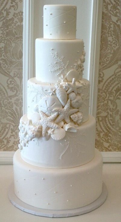 beach wedding cake with shells Rustic Beach Wedding Cake, Elegant Beach Wedding Cake, Sea Themed Wedding Cake, Under The Sea Wedding Cake, Little Mermaid Themed Wedding, Sea Shells Ideas, Beach Themed Wedding Cakes, Mermaid Wedding Theme, Beach Wedding Cake Ideas