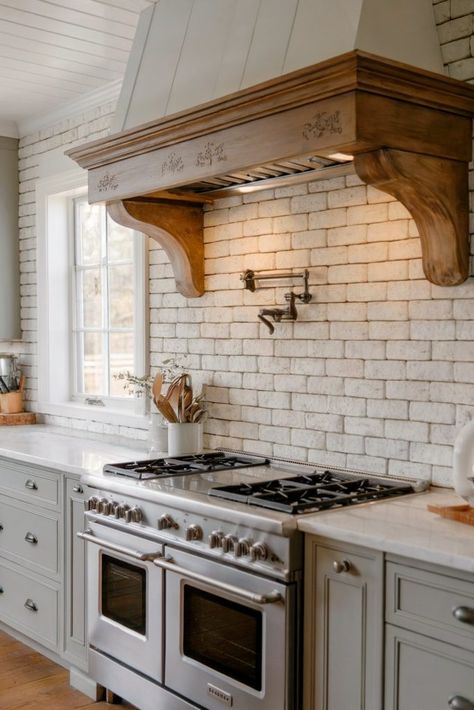 A kitchen with a white stove, wooden hood, and a light-colored brick backsplash Hoods Over Stoves, White Brick Backsplash, Backsplash Kitchen Ideas, Backsplash Inspiration, White Stove, Brick Kitchen Backsplash, Brick Backsplash Kitchen, Stove Backsplash, Brick Kitchen