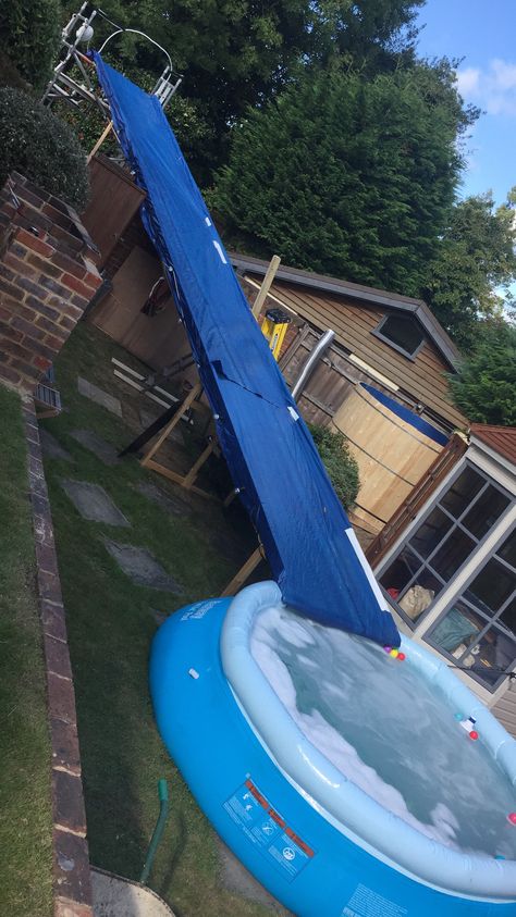 Homemade Water Slide, Pool Slide Diy, Pool Ideas Above Ground, Backyard Water Parks, Sloped Yard, Above Ground Pool Ideas, Ground Pool Ideas, Small Yards, Diy Swimming Pool