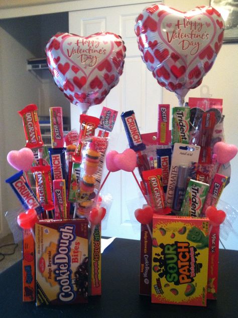 Valentines gifts I made for my kids mall items came from the Dollar Tree. I have Square piece of styrofoam with boxes of candy hot glued around it. Then using bamboo kabob sticks I hot glued candy bars and other little goodies on the sticks and stuck them into the styrofoam. Kids and adults love it. Diy Valentines Gifts For Him, Skewer Sticks, Valentines Day Baskets, Candy Bouquet Diy, Valentine Gift Baskets, Valentine Baskets, Valentine's Day Gift Baskets, Valentine Bouquet, Valentines Gift Bags