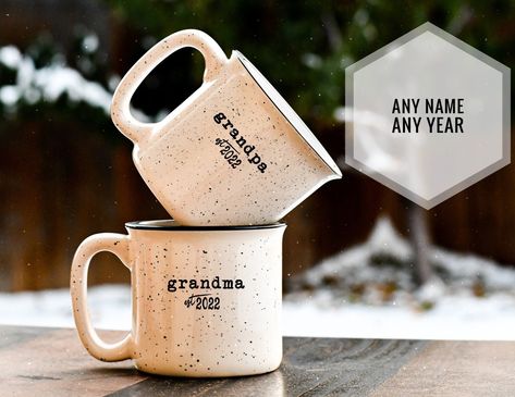 "Our pregnancy announcement gift for grandparents mug or aunt/uncle set is a great pregnancy reveal!  Wonderfully rustic look, no two are alike, this grandmother mug and grandfather mug (or whatever name) makes a wonderful gift for the newly upgraded grandparents! WHAT IS INCLUDED/OPTIONS Two Styles to choose from:  Classic Lodge Style (14oz) and Tavern \"pot-belly\" Style (16oz) Design / Method *Our ceramic Classic lodge collection is based on a vintage typewriter type-set.               oMidni First Time Grandparents Gift, Aunt And Uncle Pregnancy Announcement, Meaningful Baby Gifts, First Time Grandparents, Grandparent Announcement, Military Retirement Gift, Unique Pregnancy Announcement, New Grandparent Gifts, Happy Husband