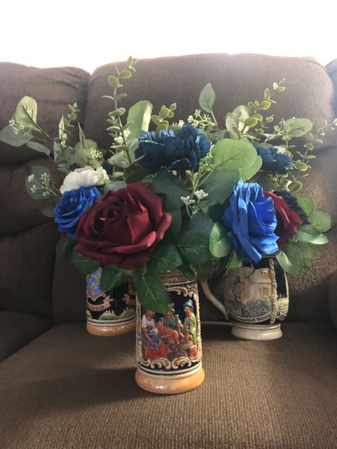 Beer 
Wedding 
Wedding centerpiece 
Beer stein Beer Stein Centerpiece, Beer Wedding, Brewery Wedding, Beer Stein, Wedding Centerpiece, Wedding Florals, Holiday Wedding, Beer Steins, Wedding Centerpieces