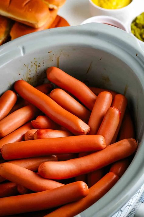 How to cook easy Crock Pot hot dogs with the best flavor. Great make-ahead recipe that you can use to set up the ultimate hot dog bar with all of your favorite toppings to serve at your next summer potluck or backyard BBQ! Crockpot Hotdogs, Crock Pot Hot Dogs, Hot Dogs For A Crowd, Homemade Chili Cheese Fries, Cook For A Crowd, Boiled Hot Dogs, Making Hot Dogs, Grilling Hot Dogs, Hot Dog Toppings