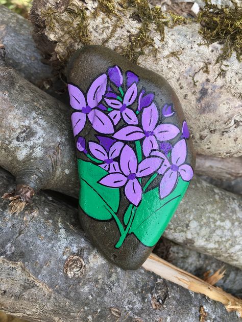 Painted rock flowers Eggplant Rock Painting, Purple Painted Rocks, Floral Painted Rocks, Lilac Rock Painting, Rock Butterfly Painted Stones, Rock Flowers, Rock Collection, Stone Art, Painted Rocks