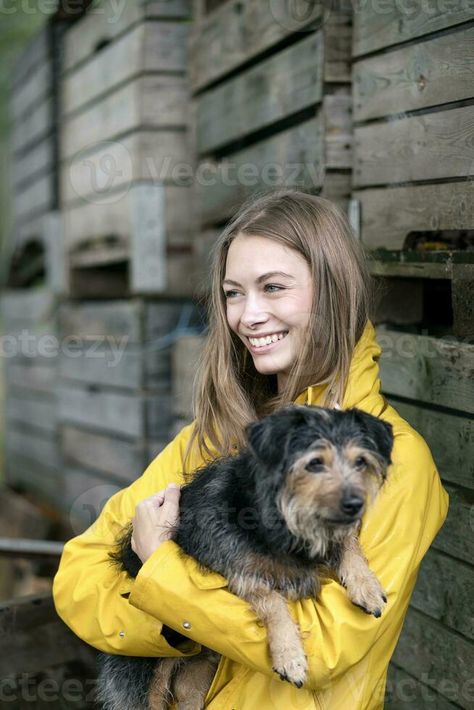 Smiling woman on a farm standing at wooden boxes holding dog Holding Dog Pose, Smiling Woman, Dog Poses, Farm Stand, Gesture Drawing, Dog Dog, Vector Graphics, Wooden Boxes, Anatomy