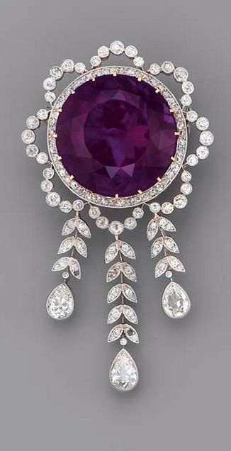 A BELLE EPOQUE AMETHYST AND DIAMOND BROOCH The circular-cut amethyst within the diamond garland surround, suspending a graduated fringe of diamond leaves to the three pear-shaped drops, millegrain setting, mounted in platinum and gold, circa 1900 Bijoux Art Nouveau, Purple Jewelry, Diamond Brooch, Royal Jewels, Amethyst Jewelry, 판타지 아트, Deco Jewelry, I Love Jewelry, Vintage Jewels