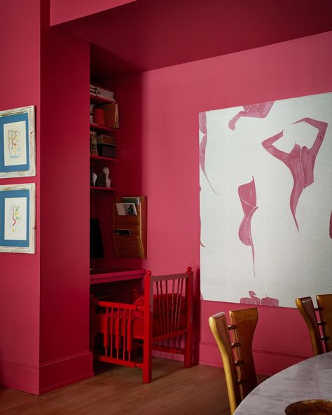 Tour the Hot Pink New York Home of a Spanish Fashion Designer | Architectural Digest | Architectural Digest West Elm Tables, Saarinen Dining Table, Coastal Glam, New York Home, Over The Couch, Red Armchair, New York Homes, Spanish Fashion, Eero Saarinen