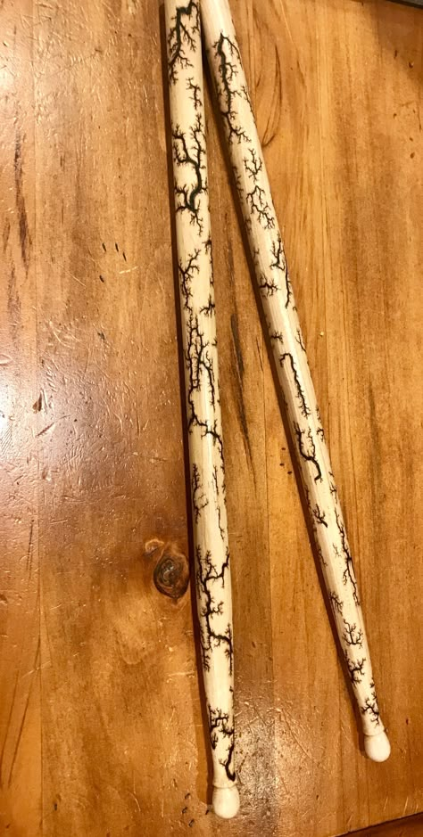 Fractal drumsticks Decorated Drumsticks, Drum Sticks Aesthetic, Painted Drum Sticks, Cool Drumsticks, Custom Drumsticks, Lichtenberg Wood Burning, Fractal Wood, Fractal Burning, Carved Walking Sticks