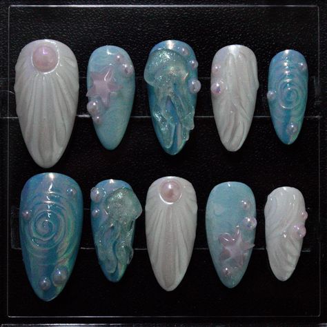 wavy baby!!🌊🪼 ——————— First time creating 3D jellyfish and seashells!! Soo fun I got a new 3D gel and its so much easier to do the swirls now 🌀 DM to purchase! ——————— #summernails #pressonnails #gelnails #seanails #oceannails #seashellnails #3dnailart #summer #summertime #bluenails #jellyfishnails Jellyfish Mermaid, Mermaid Chrome, Ocean Nails, Nail Shop, Star Charms, Jellyfish, Art Designs, Press On Nails, Nail Art Designs