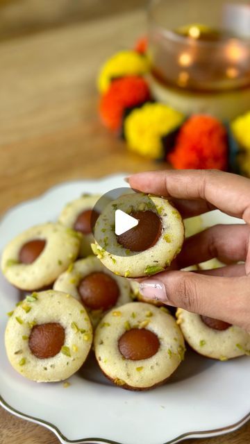 Aditi Goyal | Adilicious on Instagram: "DAY 4 of DIWALI WEEK
Gulab Jamun Mini Cakes

RECIPE 
70 grams ( 1/4 cup) Curd/Yogurt
50 grams ( 1/4 cup) Granulated Sugar
25g (2tbsp) Melted Butter
65 grams ( 1/2 cup ) All Purpose Flour
1/2 tsp Baking Powder
1/4 tsp Baking Soda
1/4 tsp Cardamom powder
2 tbsp Milk

Mini Gulab Jamuns & Pista

🪔 whisk together yoghurt and sugar along with melted butter until mixed well
🪔 Sift in the all purpose flour, baking powder, baking soda and cardamom powder in the yogurt mixture and form a smooth batter along with some milk.
🪔 Heat appe pan on medium heat & brush it with some oil pipe in the batter add a mini gulab jamun  in the in the middle and some pistachio oh top
🪔 Cover and cook for 7-8 mins or until done. 
🪔 Remove from pan and serve!

Save the recip Gulab Jamun Fusion Dessert, Mini Cakes Recipe, Heat Brush, Gulab Jamun Recipe, Mini Cake Recipe, Jamun Recipe, Fusion Recipes, Oil Pipe, Gulab Jamun