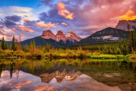 If you have visited the town of Canmore, or nearby Banff, you have likely seen, or at least heard about the Three Sisters in Canmore. They are easily the Gorgeous Backyards, Quarry Lake, Things To Do In Banff, Vermillion Lakes, Canmore Alberta, The Three Sisters, Mining Town, Canada Travel Guide, Banff Canada