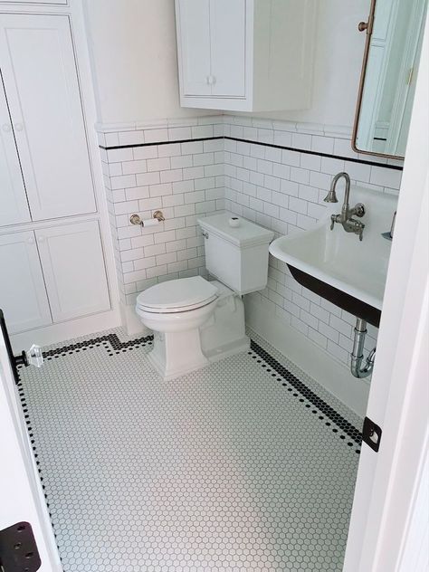 glossy white subway tile 1/3 of the way up the wall and added a black pencil liner with trim. Then we did a vintage pattern border on the floor with classic 1″ black and white matte hexagon tiles. The grout in here Mapei is Silver - House of Hargrove Black And White Hexagon Tile Bathroom, White Hexagon Tile Bathroom, Vintage Bathroom Floor, Black Tile Bathroom Floor, Hexagon Tile Bathroom Floor, Black And White Bathroom Floor, Penny Tiles Bathroom, Hexagon Tile Bathroom, Black Tile Bathrooms