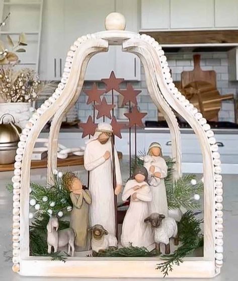 There's something truly special about nativity scene displays this time of year. Here are over 20 ideas for bringing this essence of Christmas to life in your home. Christmas Tree Figurine Display, How To Display Willow Tree Figurines, Nativity On Mantle, Willow Tree Angel Display Ideas, Willow Tree Decor Ideas, Willow Tree Nativity Set Display Ideas, Willow Tree Figurines Display Ideas, Nativity Scene Display Ideas, Nativity Table Centerpiece