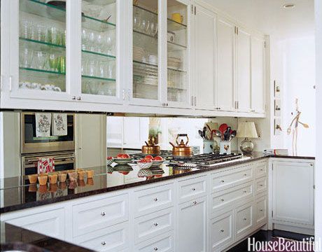 A mirrored backsplash in this Manhattan apartment gives the illusion of more space. Design: Faye Cone Mirrored Backsplash, Cocina Shabby Chic, Galley Kitchen Design, Mirror Backsplash, Galley Kitchens, Galley Kitchen, Perfect Kitchen, Chic Kitchen, Shabby Chic Kitchen