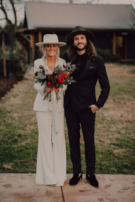 Cause We Can EventsIntimate Nashville Wedding at Arrington Vineyards | Cause We Can Events White Hat Wedding, Bride Pants Wedding, Brides With Hats, Hair Styles With Flat Brim Hats, Groom In Hat, Bride And Groom Hats, Black And White Bride And Groom, White Suit Bride, Matching Suits Couple