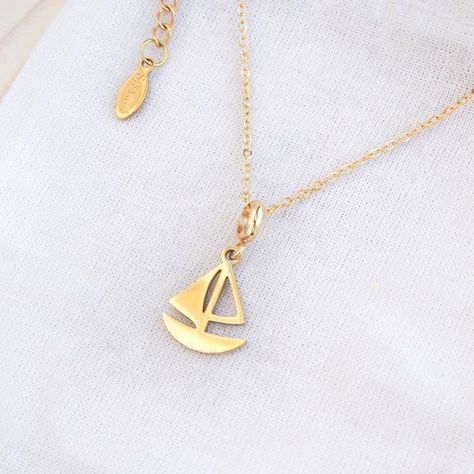 ༄ 𝗚𝗼𝗹𝗱 𝗦𝗮𝗶𝗹𝗶𝗻𝗴 𝗕𝗼𝗮𝘁 𝗡𝗲𝗰�𝗸𝗹𝗮𝗰𝗲, inspired by the rich maritime history of Portugal and combines elegance with a touch of the ocean. ⛵ Made with high quality 𝟭𝟰𝗸 𝗴𝗼𝗹𝗱 𝗽𝗹𝗮𝘁𝗲𝗱 stainless steel, this necklace makes a thoughtful and memorable gift for ocean lovers, sailors, or anyone with a love for the maritime culture.✨ ➡️ available on 𝘀𝗲𝗮𝗯𝘆𝗹𝗼𝘂.𝗰𝗼𝗺 ▼ 14k gold plated stainless steel ▼ Length: 45 cm with extend option to 50 cm ▼ Pendant is approx. 20 mm . #sailingboat #sailingboatjewelry #sailin... History Of Portugal, Boat Girl, Sailing Boat, Ocean Lover, Shell Art, Ocean Inspiration, Memorable Gifts, Boat Neck, A Love