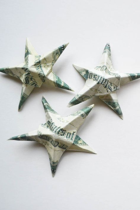 Money Star and Starfish Origami 1 Dollar Tutorial DIY Folded No glue This is a simple tutorial on making star or starfish origami of 1 dollar bills. You will need a little time. Decorate your interior or gift with a small star. Starfish Origami, Origami With Money, Oragami Money, Money Star, Dollar Bill Art, Folding Tricks, Origami Dollar Bill, Origami Dollar, Baby Money