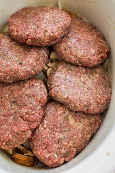 A favorite family meal this easy Salisbury steak recipe is made in the slow cooker making it an easy weeknight dinner Slower Cooker Salisbury Steak, Crockpot Salisbury Steak With Hamburger Patties, Hamburger Meat In Crockpot Recipes, Slow Cooker Hamburger Steaks, Ground Hamburger Crockpot Recipes, Crockpot Salsberry Steaks, Group Crockpot Meals, Hamburgers In Crockpot, Hamburg Crockpot Recipes