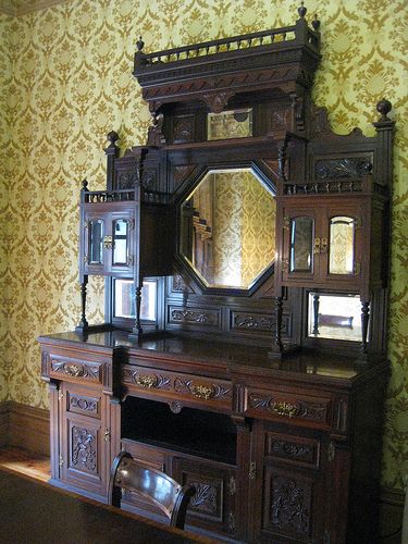 A Victorian Sideboard in the Yellow Dining Room of Tasma Terrace - Parliament Place, East Melbourne Swahili Furniture, Victorian Sideboard, Old Mansions Interior, Eastlake Furniture, 1920s Furniture, Eastlake Victorian, Mess Hall, Yellow Dining Room, Dining Room Victorian