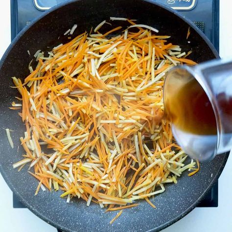 Stir fried to perfection, Kinpira Gobo is a delicious Japanese side dish of carrot and burdock root in a sauce of soy, mirin and sake. Vegan friendly too! Carrot Stir Fry, Japanese Side Dish, Asian Side Dishes, Stir Fry Sauce, Burdock Root, Stir Fry, Vegan Friendly, Side Dish, Sake