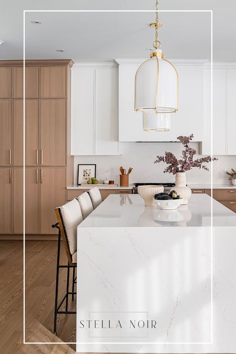 The white oak cabinetry exudes a sense of timeless elegance, its natural grain adding a touch of organic charm to the clean design. Paired with Benjamin Moore’s Chantilly Lace paint, the space feels airy and bright. As sunlight streams in through the oversized windows, it dances off of the semi-polished Silestone quartz countertops in the color Etheral Glow. The clean lines and uncluttered countertops allow the beauty of the white oak to take center stage. Silestone Ethereal Glow, Chantilly Lace Paint, Mix Wood Tones, Silestone Quartz Countertops, Noir Design, Baths Interior, Lace Painting, Oversized Windows, Wood Tones