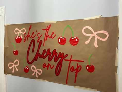 Add a sweet touch to your celebration with our "She's the Cherry on Top" hand-painted banner! This eye-catching design features vibrant red cherries and playful pink bows, making it the perfect statement piece for birthdays, bachelorette parties, or any special event.  Each banner is hand-painted with care on high-quality Kraft paper, ensuring a unique and personal touch to your decor. Choose from two sizes: 30" x 64"  24" x 51" Want to make it even more special? Our banners are fully customizable! Change the colors, add a name, or modify the message to make it your own. **Why You'll Love It - **Hand-Painted Each banner is individually painted by hand, making every piece one-of-a-kind. - **Customizable Personalize your banner to match your event's theme and vibe. - **Versatile Perfect for 4th Of July Painted Banner, Our Little Cherry On Top, Shes The Cherry On Top, She’s A Cherry On Top, 27th Birthday Themes For Women, Sorority Sheet Signs, Banner Painting Ideas, Birthday Banners Painted, Brown Paper Painted Banner