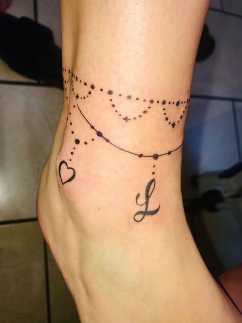 Bead anklet tattoo Floral Anklet Tattoos For Women, Ankle Name Tattoo, Tattoos For Women Watercolor, Tattoos With Initials, Tattoos For Women Minimalist, Children Tattoos, Anklet Tattoos For Women, Flesh Art, Anklet Tattoo