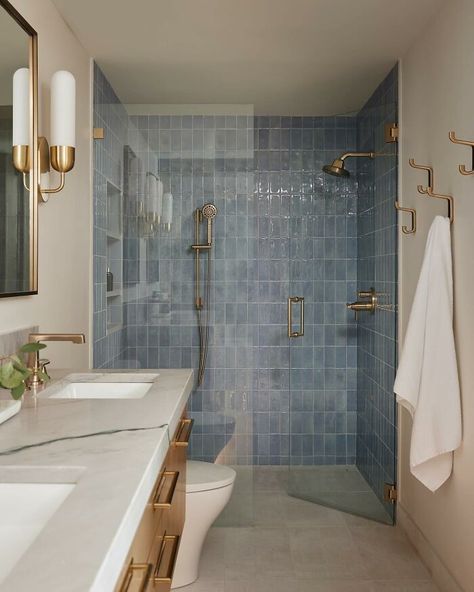 Pale blue colored walk-in shower with brass fixtures Teenager Bathroom Ideas, Teenager Bathroom, Master Shower Tile, Blue Shower Tile, Tile Walk In Shower, Small Full Bathroom, Designer Tiles, Subway Tiles Bathroom, Master Shower