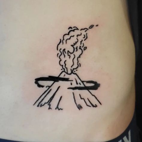 A simple but adorable minimalistic volcano tattoo, done by @thistlekae. We love the animated sort of look to the design, especially in the cloud ring around the volcano. Simple Volcano Tattoo, Simple But Cool Tattoos, Small Volcano Tattoo, Volcano Tattoo Design, Volcano Tattoos, Volcano Tattoo Minimalist, Iceland Tattoo Ideas, Lava Tattoo, Napoli Tattoo