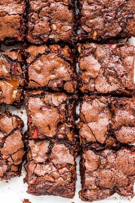 PIN TO SAVE! Chocolate rhubarb brownies are a rich and decadent treat that stays super moist from the rhubarb. They're fudgy and sweet with chocolate chips and walnuts and just the right amount of rhubarb flavor. You'll love them! #theendlessmeal #brownies #brownierecipe #rhubarb #rhubarbbrownies #rhubarbdessert #rhubarbrecipe #spring #springdessert Rhubarb And Chocolate Recipes, Chocolate Rhubarb Pie, Rhubarb Brownies Recipes, Rhubarb Chocolate Recipes, Chocolate Rhubarb Recipes, Chocolate Rhubarb Brownies, Chocolate Rhubarb Cake, Rhubarb Brownies, Chocolate Summer Desserts