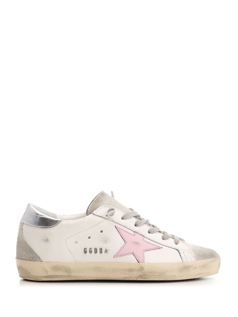 White leather "Super Star" sneakers from Golden Goose with pink star and laminated heel, suede insert on the toe and heel, gray laces. Off White Sneakers Outfit Women, Golden Goose Shoes Pink, Babble And Goose Star Joggers, Golden Goose Pink Star, Fake Golden Goose Sneakers, Golden Goose Sneakers Pink, Sneaker Inspo Women, Pink Golden Goose Sneakers, Golden Goose Aesthetic