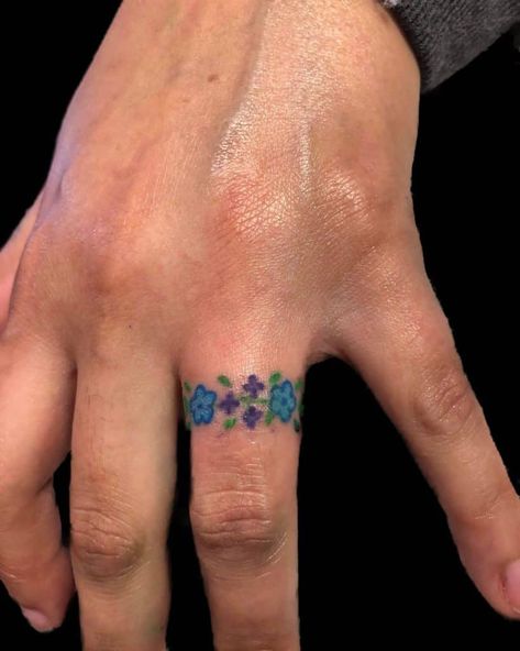 Floral Patterns 3 Floral Ring Tattoo Designs, Flower Wedding Band Tattoo, Wedding Band Tattoo For Her Floral, Flower Ring Tattoo, Toe Ring Tattoos, Wedding Ring Finger Tattoos, Wedding Ring Tattoos, Flower Finger Tattoos, Ring Tattoo Designs