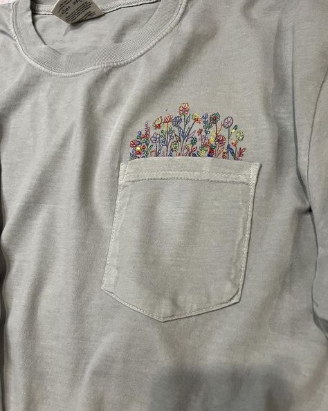 I love anything floral! This Comfort Colors pocket tee is so soft and the embroidered colorful flowers coming out of the pocket are so delicate and pretty. Other shirt colors and thread colors are also available. Please visit my Etsy shop for more. https://villageembroideryllc.etsy.com T Shirt Embroidery, Embroidery Tshirt, Thread Colors, Shirt Embroidery, Pocket Tee, Colorful Flowers, Coming Out, Comfort Colors, Colorful Shirts