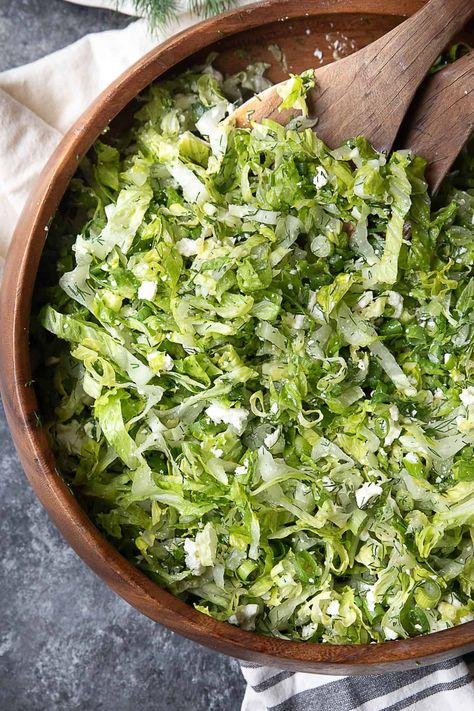 Maroulosalata is a classic Greek salad made with finely chopped romaine lettuce, dill, fresh green onions, and creamy feta cheese, all tossed in a refreshing lemony dressing! It’s a quick and simple salad to prepare, but you’ll be amazed by the burst of flavors it delivers! Shabbat Green Salad, Recipes With Shredded Lettuce, Romaine Salad Ideas, Maroulosalata Salad, Easy Lettuce Salad, Romaine Salad Recipes, Greek Lettuce Salad, Romaine Lettuce Recipe, Simple Salad Recipes