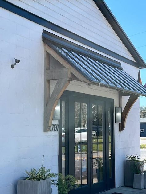 Portico Over Patio Door, Exterior Awnings For Windows, Front Door Overhang Entrance Metal Roof, Adding Roof Over Front Door, Door Overhang Ideas Exterior, Wooden Awnings Over Doors, Metal Window Awnings Exterior, Cedar Gables On House Exterior, Front Door Awning Entrance